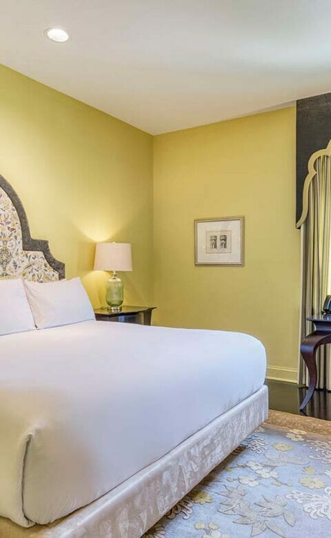 king room in hotel with bed and desk area